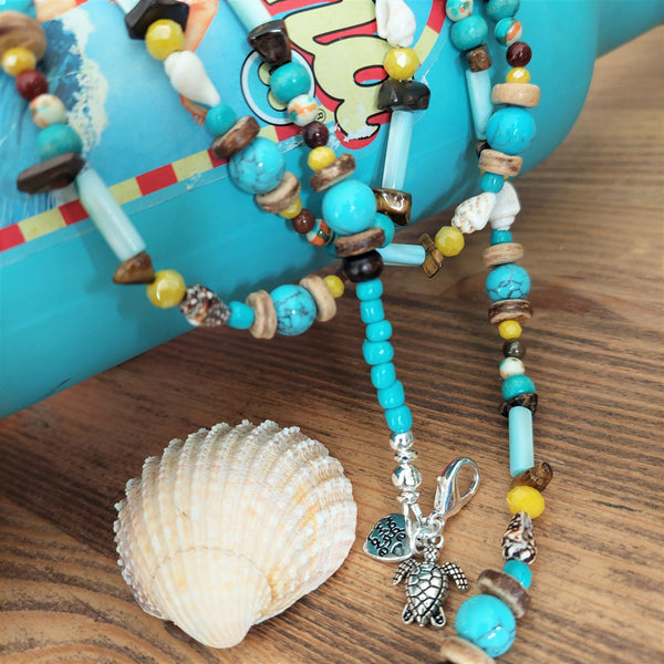 A super cool long bead surf necklace in lovely blue, yellow & brown colours. A Perfect addition to all your Summer outfits.  A combination of natural stone, shell, calcite, wood & silver hematite beads   Silver plated fastenings & clasp with silver (nickel free) 'made with love' heart & little turtle charm  length 74cm  Gift wrapped & presented in a pretty organza pouch