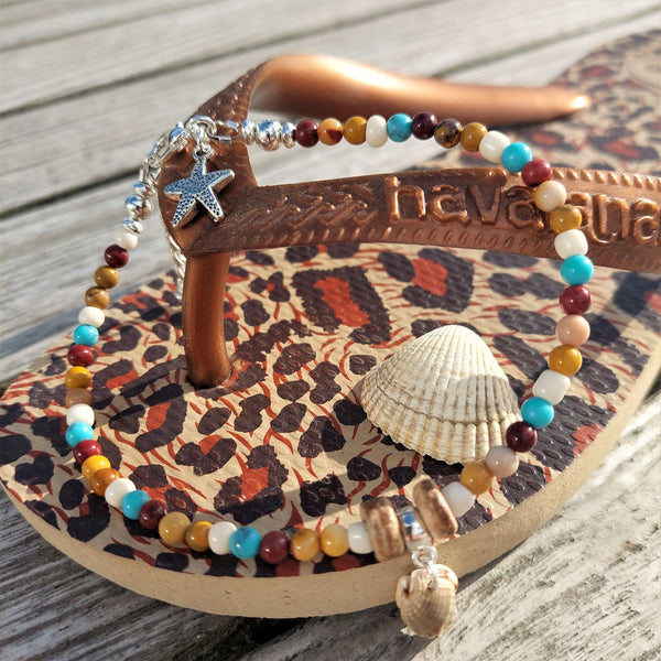 Super cute beach anklet, handmade with natural stone quartz beads & sea shell  Each anklet has sterling silver plated fastenings, lobster clasp & starfish (nickel free) charm  Length - 24cm extends to 27cm  Perfect gift for any surf chick!  **Presented in lovely Kraft paper gift box with reusable organza pouch**