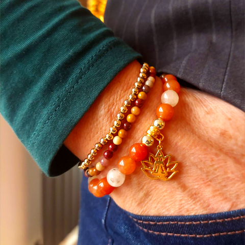 Lovely shades of amber 8mm quartz beaded bracelet with gold plated beads &amp; namaste figure charm, handmade with love!

Each bracelet will be unique due to varying colour shades of the stone beads

Elasticated, so will fit most adult wrists (measuring 71/2 in/19cm)

Lovely gift for a spiritual/mindful person in your life