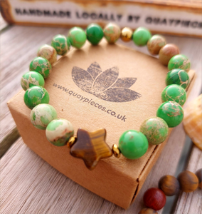 Lovely green/brown coloured 8mm imperial jasper stone bead bracelet with cute tigers eye star &amp; bronze hematite beads

Each bracelet will be unique due to varying colour shades of the stone beads

Elasticated, so will fit most adult wrists (measuring 71/2 in/19cm)

**Presented in lovely Kraft paper gift box with reusable organza pouch**