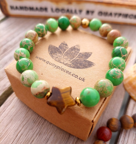 Lovely green/brown coloured 8mm imperial jasper stone bead bracelet with cute tigers eye star &amp; bronze hematite beads

Each bracelet will be unique due to varying colour shades of the stone beads

Elasticated, so will fit most adult wrists (measuring 71/2 in/19cm)

**Presented in lovely Kraft paper gift box with reusable organza pouch**
