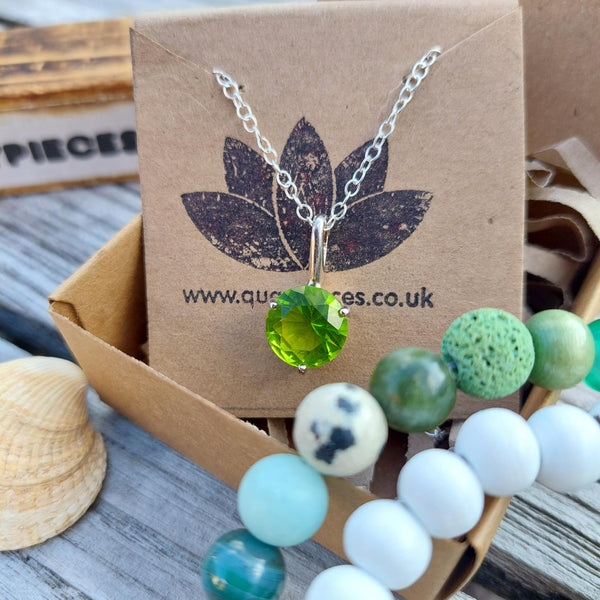 925 Hall Marked Sterling Silver Super sparkly green cubic zirconia gemstone pendant H 18 mm (from top of pendant) x W 10 mm 18" Silver 1 mm dainty diamond cut chain Lovely little gift for a friend or loved one! **Presented in lovely Kraft paper gift box with reusable organza pouch**