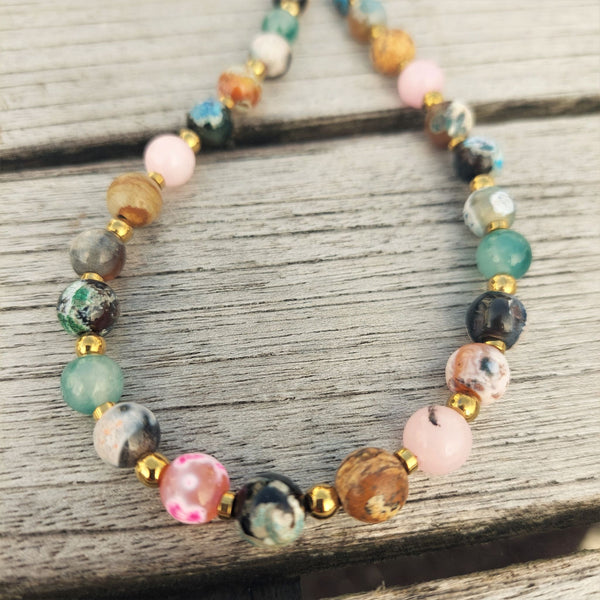 Stunning handmade multicolour agate bead necklace.  With a vintage look & a touch of bohemian style, each beautiful stone bead is a different  colour divided by gold plated hematite beads with gold plated fastenings & lobster clasp.  Agate is a t﻿﻿ype of natural stone that has a grounding effect.  Length - 42cm   Perfect for wearing with those cosy winter jumpers!  **Presented in lovely Kraft paper gift box with reusable organza pouch**