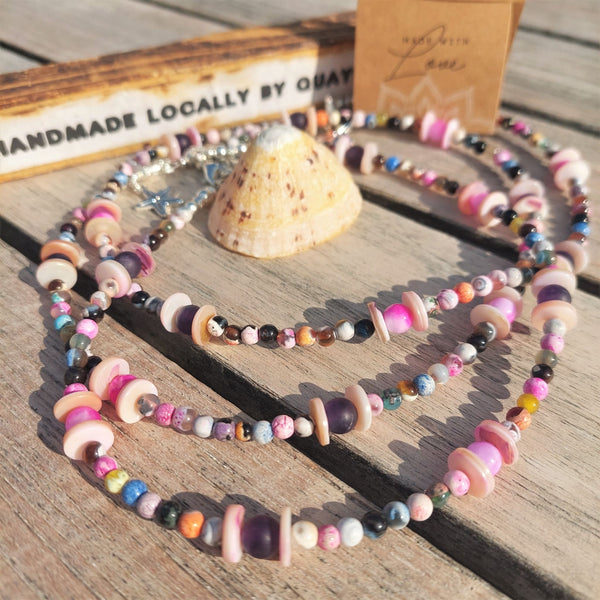 ﻿Lovely short choker style necklace, 4mm natural stone beads in shades of pinks & purple with pink shell discs   Silver plated fastenings & lobster clasp with silver (nickel free) starfish charm  Length - 38cm   Perfect for wearing with those cool summer T-shirts!  **Presented in lovely Kraft paper gift box with reusable organza pouch**
