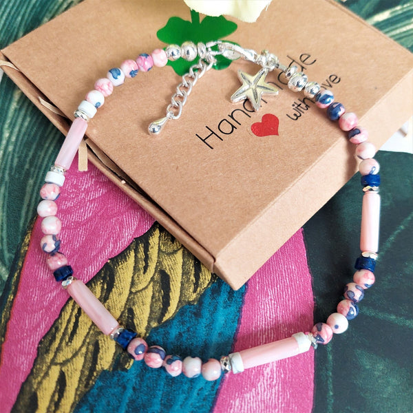 ﻿Super cute beach anklet, handmade with pink & blue marble effect natural stone beads, s silver hematite & stone discs with pink shell tubes.  Each anklet has sterling silver plated fastenings, lobster clasp & starfish (nickel free) charm  Length - 24cm extends to 27cm  Perfect gift for any surf chick!  **Presented in lovely Kraft paper gift box with reusable organza pouch**   **To keep your quaypieces looking great, always take me off before showering or swimming.