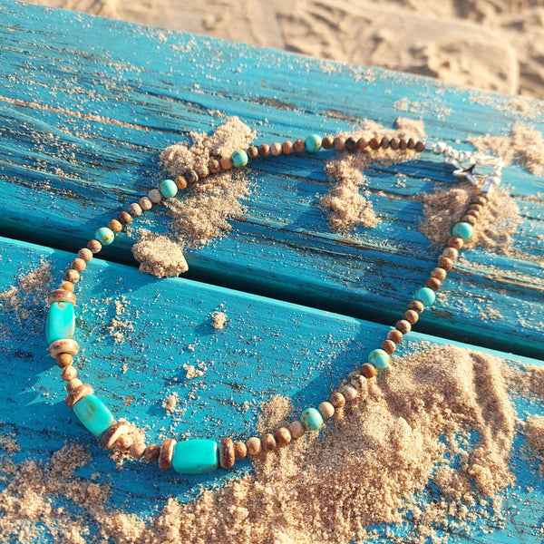 Lovely tawny colour stone beaded necklace with chunky oblong turquoise tubes & coconut discs. The necklace has silver plated fastenings, lobster clasp & silver hanging starfish (nickel free) Length - 41cm Perfect surf style accessory with winter Tees! **Presented in lovely Kraft paper gift box with reusable organza pouch**