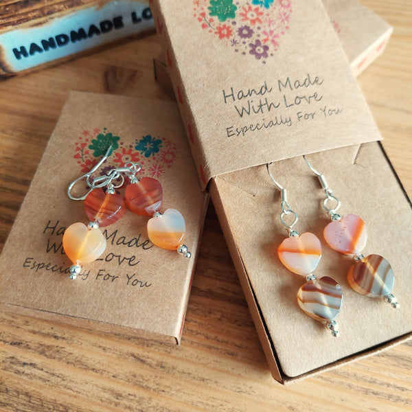 Lovely Handmade Stone Heart earrings in amber tones with sterling silver beads  Each pair is slightly different due to the nature of the beads  925 Sterling Silver Hook  Length 30mm from bottom of hook  Perfect addition to your winter outfits!