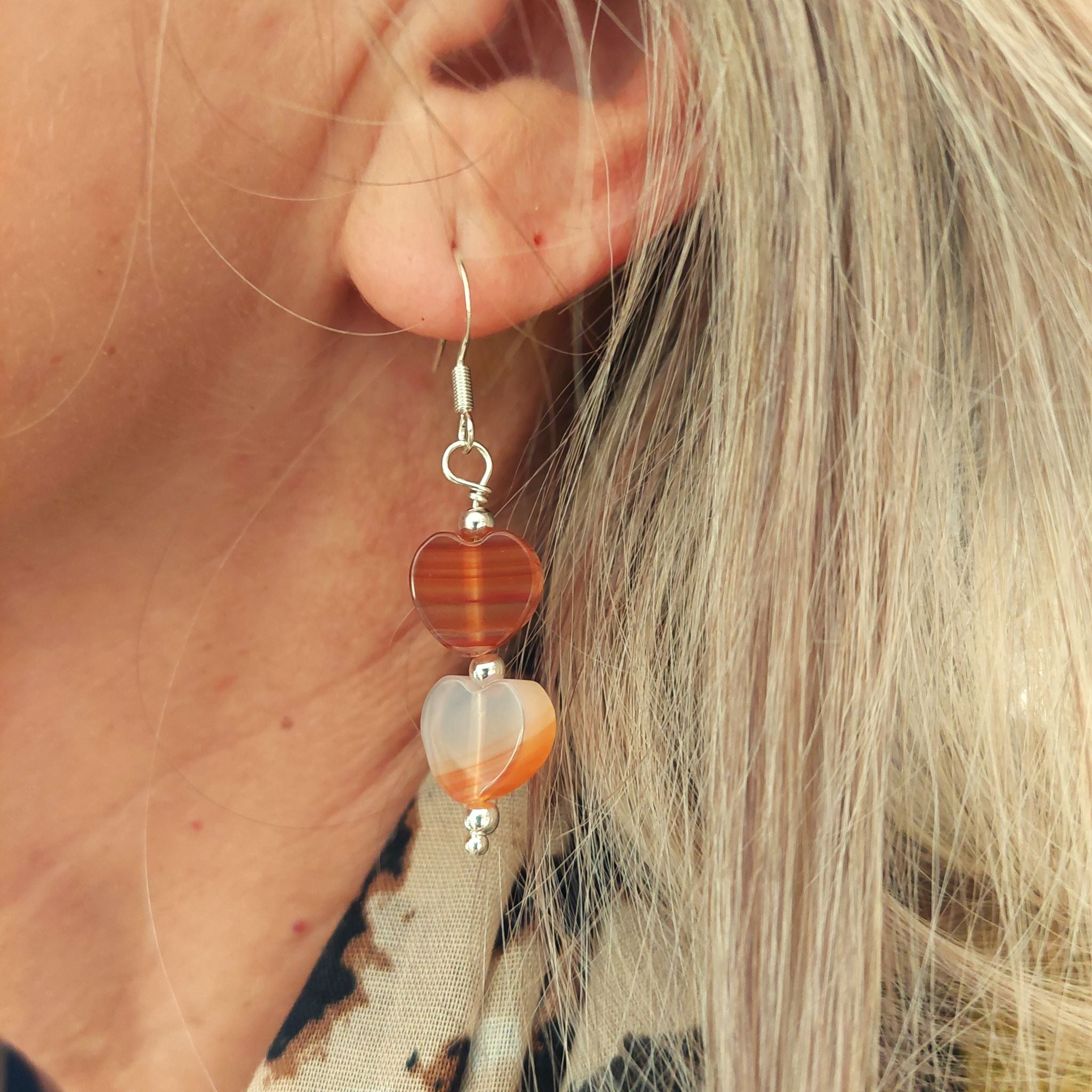 Lovely Handmade Stone Heart earrings in amber tones with sterling silver beads  Each pair is slightly different due to the nature of the beads  925 Sterling Silver Hook  Length 30mm from bottom of hook  Perfect addition to your winter outfits!