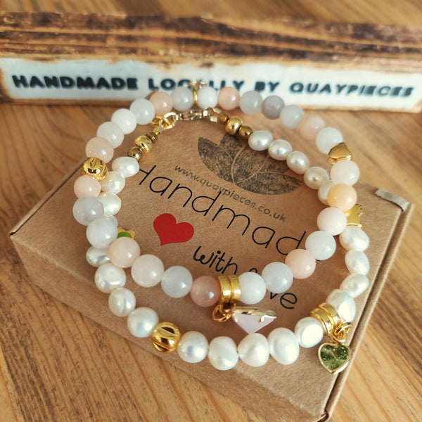 Gorgeous quartz bead bracelet in creamy ivory & peach tones with gold plated charms & stone heart ﻿  Elasticated, so will fit most adult wrists (measuring 7.5in/19cm)  Perfect for wearing stacked or solo with your winter outfits!  **Presented in lovely Kraft paper gift box with reusable organza pouch**