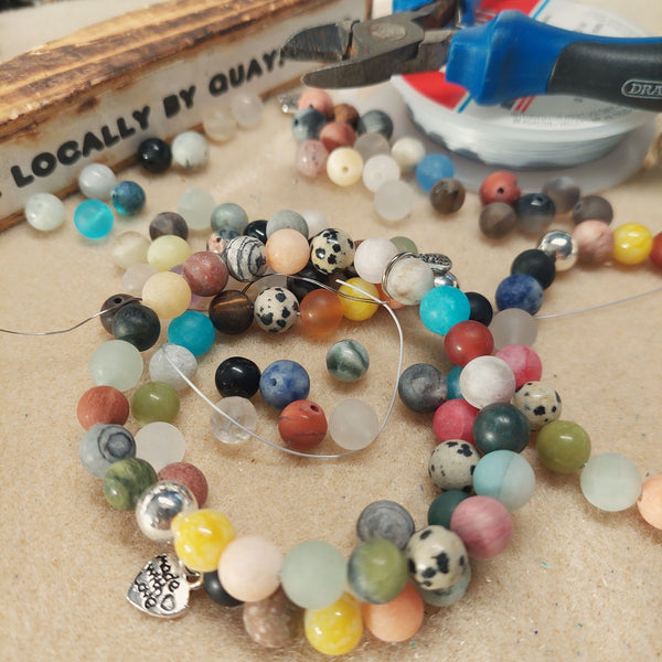 'February' ﻿﻿Lovely Handmade 8mm Stone Multicolour Bead Bracelet with Dalamatian Jasper, silver plated hematite & made with love heart (nickel free) Elasticated, so will fit most adult wrists (measuring 7.5in/19cm)  Add a bit of colour to your winter outfits!  **Presented in lovely Kraft paper gift box with reusable organza pouch**