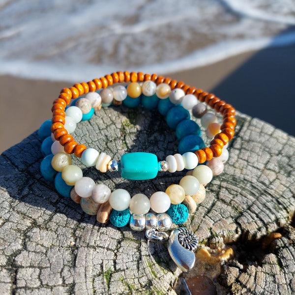 <p data-mce-fragment="1">Handcrafted Collection of 3 Wood &amp; Stone Beaded Bracelets</p> <p data-mce-fragment="1">Each Bracelet is individually designed, (1) 8mm turquoise wood &amp; aqua green stone beads, coconut discs, &amp; spiral shell charm (nickel free), (2) 6mm multicolour aqua agate stone beads plus (3) 4mm orange wood beads with shell discs &amp; silver plated hematite beads</p> <p data-mce-fragment="1">Elasticated, so will fit most adult wrists (measuring 7.5 in/19cm)</p>