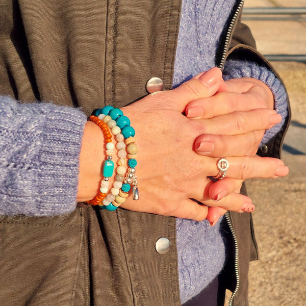 <p data-mce-fragment="1">Handcrafted Collection of 3 Wood &amp; Stone Beaded Bracelets</p> <p data-mce-fragment="1">Each Bracelet is individually designed, (1) 8mm turquoise wood &amp; aqua green stone beads, coconut discs, &amp; spiral shell charm (nickel free), (2) 6mm multicolour aqua agate stone beads plus (3) 4mm orange wood beads with shell discs &amp; silver plated hematite beads</p> <p data-mce-fragment="1">Elasticated, so will fit most adult wrists (measuring 7.5 in/19cm)</p>