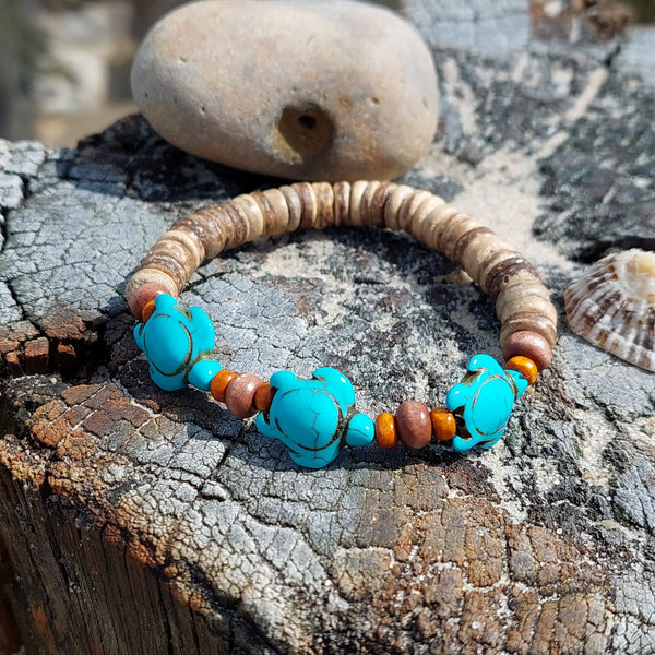 ﻿'Taylor'  Fun natural coconut disc bracelets with three cute turtles - available in turquoise or green  Elasticated, so will fit most adult wrists (measuring 7.5 in/19cm)  Great little gift for sea/beach lovers!  **Presented in lovely Kraft paper gift box with reusable organza pouch**