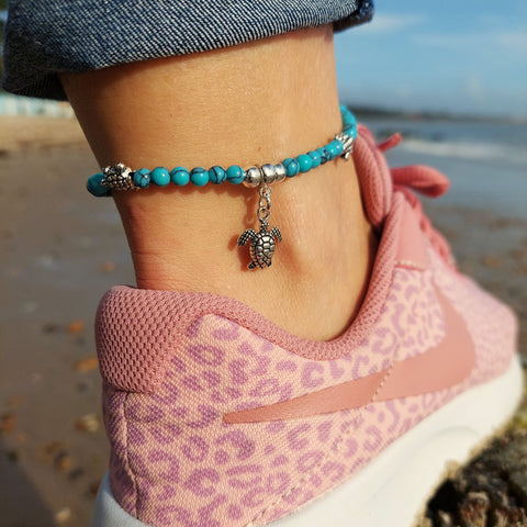 ﻿﻿Cute Anklet handmade with 4mm turquoise calcite & sterling silver plated beads with 3 turtles (nickel free) & starfish charms  Each anklet has sterling silver plated fastenings, lobster clasp & extension chain to adjust the length.  Length - 23cm extends to 26cm  Add a bit of boho beach chic to your ankles this Summer!  **Presented in lovely Kraft paper gift box with reusable organza pouch**