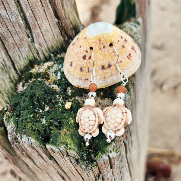 Super cute howlite turtle earrings with silver plated beads - available in 2 colours  Turquoise or Ivory  925 Sterling Silver Hook  Length 35mm from bottom of hook  Fun accessory for your Summer outfits!