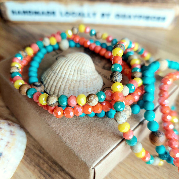 Handcrafted Collection of delicate 4mm Beaded Bracelets  Each one unique, 1) turquoise magnesite with sand colour stone beads 2) coral faceted glass beads 3) multi-colour faceted glass &amp; sand colour stone beads  Close fit elasticated, so will fit most adult wrists (measuring 7.5 in/19cm)  Add a fabulous pop of colour to your Summer outfits  **Presented in lovely Kraft paper gift box with reusable organza pouch**