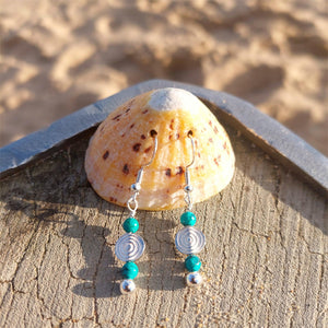 925 Hall Marked Sterling Silver

Lovely Handmade Earrings with Sterling silver beads, turquoise stone &amp; silver circle swirl wave

H 22 mm from bottom of hook

Gorgeous little gift for a friend or a treat for yourself!