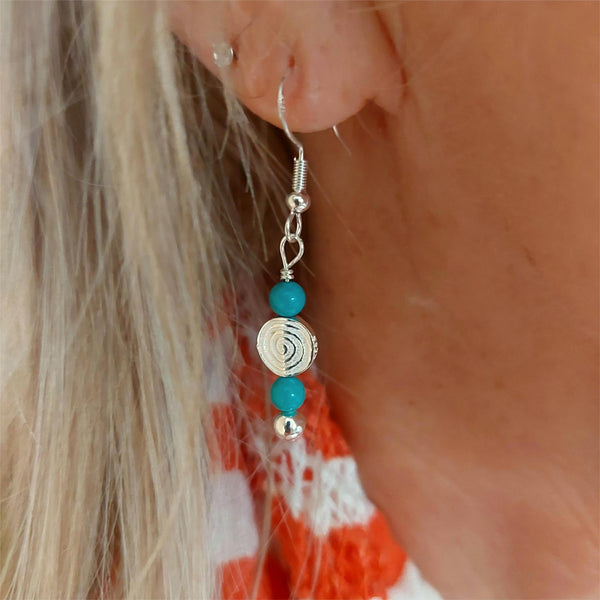925 Hall Marked Sterling Silver

Lovely Handmade Earrings with Sterling silver beads, turquoise stone &amp; silver circle swirl wave

H 22 mm from bottom of hook

Gorgeous little gift for a friend or a treat for yourself!