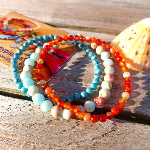 Super cool handcrafted set of 3 Beaded Bracelets

Each Bracelet is individually designed one with 4mm turquoise calcite beads, the second with&nbsp;4mm faceted amber agate beads &amp; the third with 6mm pale blue jasper beads.
A perfect Summer combination!

Elasticated, so will fit most adult wrists (measuring 7.5 in/19cm
(they are designed to fit snugly)

**Presented in lovely Kraft paper gift box with reusable organza pouch**