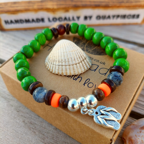 Fun sea creature bracelets, handmade with wood, ceramic &amp; stone beads, coconut discs &amp; silver plated beads charms

Elasticated, so will fit most adult wrists (measuring 7.5 in/19cm)

Each bracelet may be slightly different.

Great little gift to make someone's day or cheer up a friend!

**Presented in lovely Kraft paper gift box with reusable organza pouch**