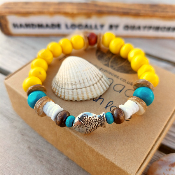 Fun sea creature bracelets, handmade with wood, ceramic &amp; stone beads, coconut discs &amp; silver plated beads charms

Elasticated, so will fit most adult wrists (measuring 7.5 in/19cm)

Each bracelet may be slightly different.

Great little gift to make someone's day or cheer up a friend!

**Presented in lovely Kraft paper gift box with reusable organza pouch**