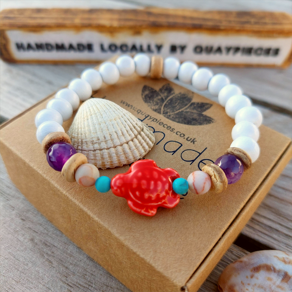 Fun sea creature bracelets, handmade with wood, ceramic &amp; stone beads, coconut discs &amp; silver plated beads charms

Elasticated, so will fit most adult wrists (measuring 7.5 in/19cm)

Each bracelet may be slightly different.

Great little gift to make someone's day or cheer up a friend!

**Presented in lovely Kraft paper gift box with reusable organza pouch**