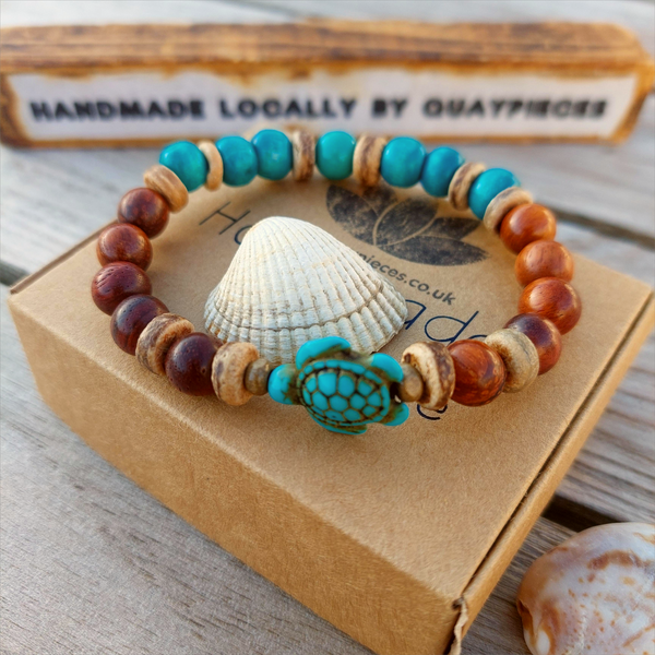 Fun sea creature bracelets, handmade with wood, ceramic &amp; stone beads, coconut discs &amp; silver plated beads charms

Elasticated, so will fit most adult wrists (measuring 7.5 in/19cm)

Each bracelet may be slightly different.

Great little gift to make someone's day or cheer up a friend!

**Presented in lovely Kraft paper gift box with reusable organza pouch**