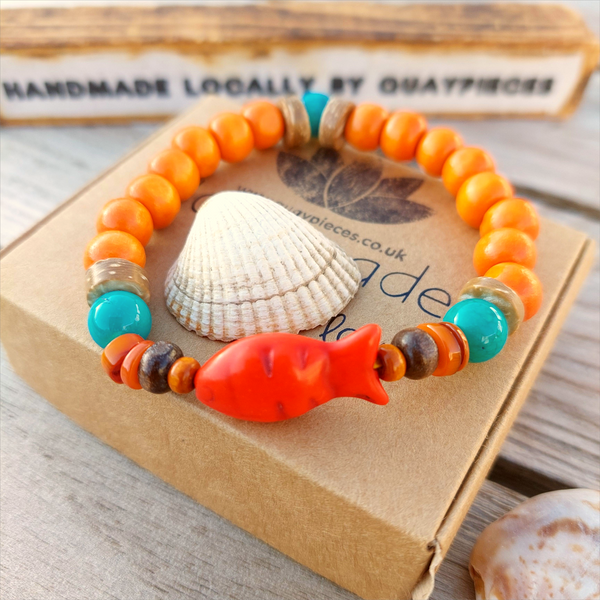 Fun sea creature bracelets, handmade with wood, ceramic &amp; stone beads, coconut discs &amp; silver plated beads charms

Elasticated, so will fit most adult wrists (measuring 7.5 in/19cm)

Each bracelet may be slightly different.

Great little gift to make someone's day or cheer up a friend!

**Presented in lovely Kraft paper gift box with reusable organza pouch**