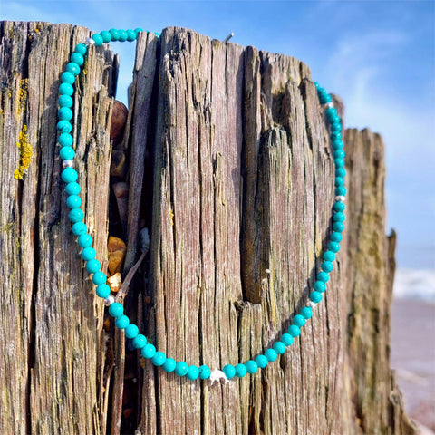 Adorable handcrafted choker made with 4mm turquoise stone beads &amp; sterling silver beads, featuring an absolutely charming sterling silver dolphin and finished off with a sterling silver T bar clasp. Measures 39cm - perfect for gifting to any ocean enthusiast pal!