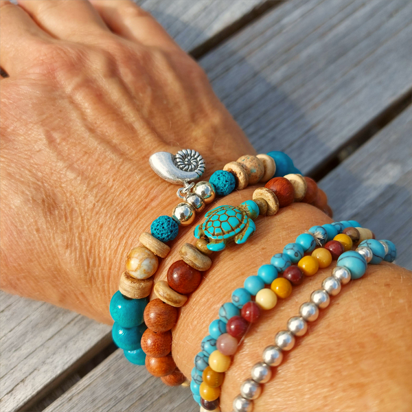 Fun sea creature bracelets, handmade with wood, ceramic &amp; stone beads, coconut discs &amp; silver plated beads charms

Elasticated, so will fit most adult wrists (measuring 7.5 in/19cm)

Each bracelet may be slightly different.

Great little gift to make someone's day or cheer up a friend!

**Presented in lovely Kraft paper gift box with reusable organza pouch**