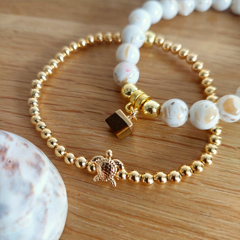 Gold plated 4mm hematite bead bracelet with cute turtle charm&nbsp;

Elasticated, so will fit most adult wrists (measuring 7.5 in/19cm)

Lovely simple bracelet to wear alone or as a stack!

**Presented in lovely Kraft paper gift box with pretty reusable organza pouch**

**To keep your quaypieces looking great, always take me off before showering or swimming. Avoid over stretching by rolling the bracelet on &amp; off your wrist**