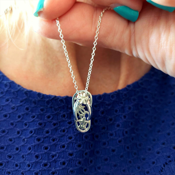 925 Hall Marked Sterling Silver Adorable cut out turtle flip flop pendant H 22 mm x W 10 mm 18" Silver 1 mm curb chain with lobster clasp Great gift for any beach buddie! **Presented in lovely Kraft paper gift box with reusable organza pouch**