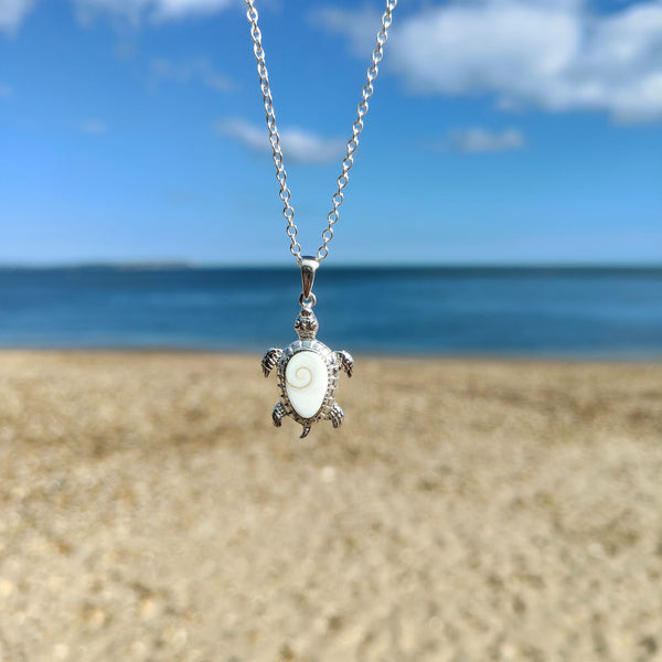 ﻿925 Hall Marked Silver Gorgeous White Turtle Pendant decorated with Shiva Shell, engraved outer edge & legs H 38 mm x W 30 mm Long 28" Sterling Silver curb chain with lobster clasp ﻿**Presented in lovely Kraft paper gift box with reusable organza pouch**