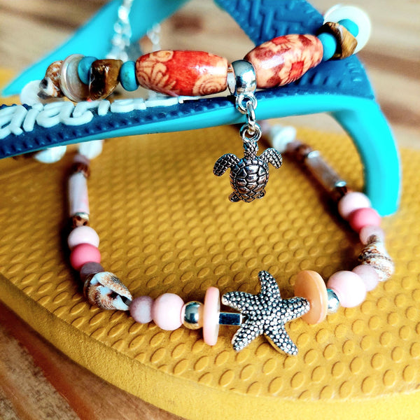 ﻿Put your best foot forward on the beach!  Cute handmade anklet with a combination of spiral shells, silver hematite, wood & stone beads with pink shell tubes & silver (nickel free) Starfish  Each anklet has sterling silver plated fastenings, lobster clasp & made with love heart charm with extension chain to adjust the length.  Length - 24cm extends to 27cm   **Presented in lovely Kraft paper gift box with reusable organza pouch**