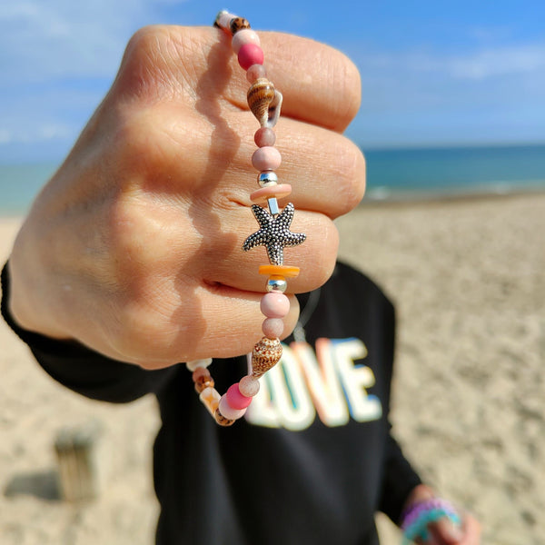 ﻿Put your best foot forward on the beach!  Cute handmade anklet with a combination of spiral shells, silver hematite, wood & stone beads with pink shell tubes & silver (nickel free) Starfish  Each anklet has sterling silver plated fastenings, lobster clasp & made with love heart charm with extension chain to adjust the length.  Length - 24cm extends to 27cm   **Presented in lovely Kraft paper gift box with reusable organza pouch**