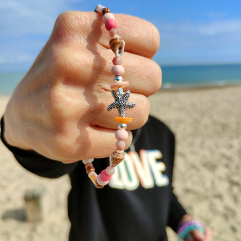 ﻿Put your best foot forward on the beach!  Cute handmade anklet with a combination of spiral shells, silver hematite, wood & stone beads with pink shell tubes & silver (nickel free) Starfish  Each anklet has sterling silver plated fastenings, lobster clasp & made with love heart charm with extension chain to adjust the length.  Length - 24cm extends to 27cm   **Presented in lovely Kraft paper gift box with reusable organza pouch**
