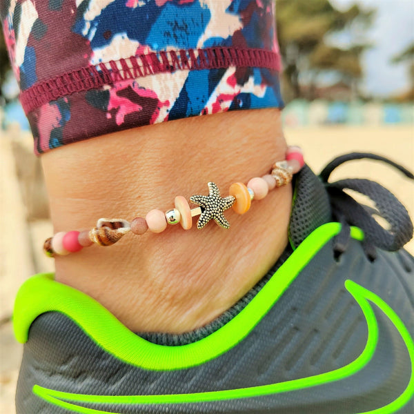 ﻿Put your best foot forward on the beach!  Cute handmade anklet with a combination of spiral shells, silver hematite, wood & stone beads with pink shell tubes & silver (nickel free) Starfish  Each anklet has sterling silver plated fastenings, lobster clasp & made with love heart charm with extension chain to adjust the length.  Length - 24cm extends to 27cm   **Presented in lovely Kraft paper gift box with reusable organza pouch**