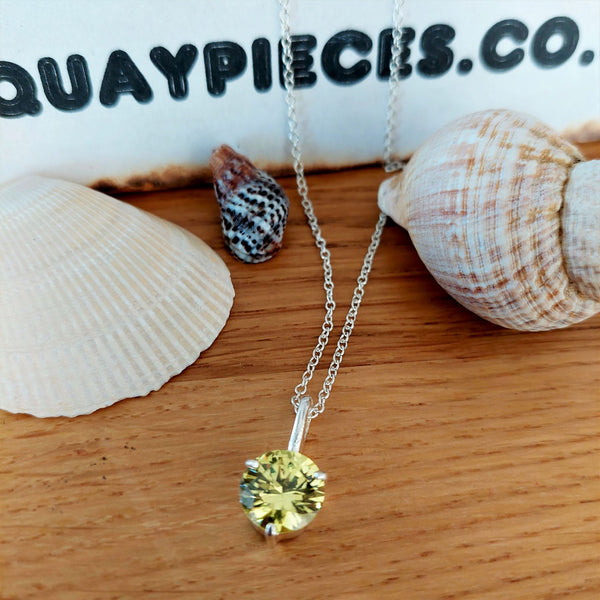925 Hall Marked Sterling Silver  Super sparkly green cubic zirconia gemstone pendant   H 18 mm (from top of pendant) x W 10 mm  18" Silver 1 mm dainty diamond cut chain  Lovely little gift for a friend or loved one!  **Presented in lovely Kraft paper gift box with reusable organza pouch**