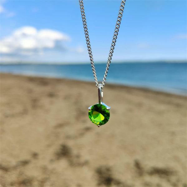 925 Hall Marked Sterling Silver Super sparkly green cubic zirconia gemstone pendant H 18 mm (from top of pendant) x W 10 mm 18" Silver 1 mm dainty diamond cut chain Lovely little gift for a friend or loved one! **Presented in lovely Kraft paper gift box with reusable organza pouch**
