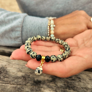 Lovely Dalamatian Jasper stone 8mm bead bracelet with gold plated charm   Elasticated, so will fit most adult wrists (measuring 71/2 in/19cm)  Perfect for wearing with those Christmas outfits & lovely gift for friends or family  **Presented in lovely Kraft paper gift box with reusable organza pouch**