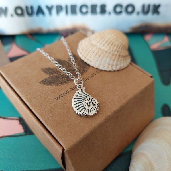 925 Hall Marked Sterling Silver  Lovely engraved shell pendant necklace  H 19mm x W 10 mm  18" Silver trace chain  Lovely little gift for beach lovers!  **Presented in lovely Kraft paper gift box with reusable organza pouch**