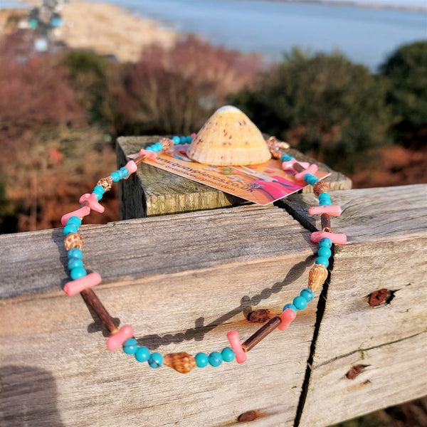 'Flossie'  Sweet beach necklace, handmade with pink bamboo chips, coconut tubes, shells & turquoise calcite beads   ﻿The necklace has rose gold plated fastenings, lobster clasp & made with love heart.   Length - 42cm  Super cute gift for any beach lover!  **Presented in lovely Kraft paper gift box with reusable organza pouch**  **To keep your quaypieces looking great, always take me off before showering or swimming**