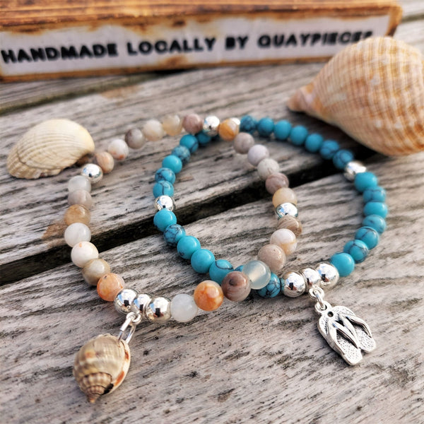 Lovely 6mm natural stone & silver plated hematite beads with a choice 2 designs   1) Grey, white tortoiseshell colour beads with natural shell  2) Turquoise calcite beads with flipflops (nickel free)  Elasticated, so will fit most adult wrists (measuring 71/2 in/19cm)  Add a cool beach vibe look to your outfit with these natural stone bracelets  **Presented in lovely Kraft paper gift box with reusable organza pouch**